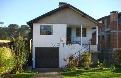 Imagem: A casa possui 3 Dormitórios, 2 Banheiros, 2 Vagas na garagem