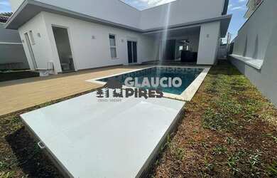 Imagem: A casa possui 3 Dormitórios, 5 Banheiros, 4 Vagas na garagem