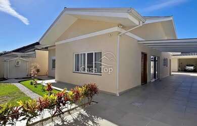 Imagem: A casa possui 4 Dormitórios, 4 Banheiros, 5 Vagas na garagem