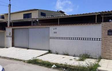 Imagem: A casa possui 3 Dormitórios, 2 Banheiros, 3 Vagas na garagem