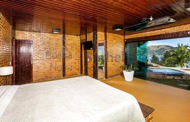 Imagem 11: Casa no alto da encosta com vista mar