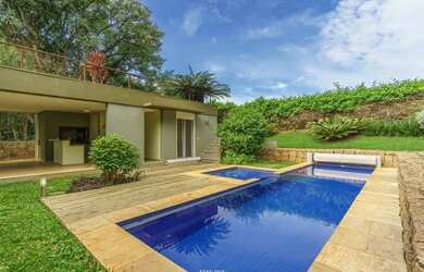 Imagem: A casa em condomínio possui 4 Dormitórios, 5 Banheiros, 5