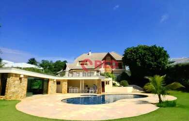 Imagem: A casa em condomínio possui 5 Dormitórios, 5 Banheiros, 4