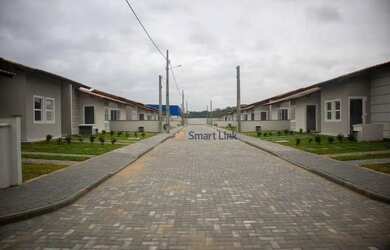 Imagem: A casa possui 2 Dormitórios, 1 Banheiro, 2 Vagas na garagem