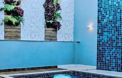 Imagem: A casa possui 3 Dormitórios, 5 Banheiros, 3 Vagas na garagem