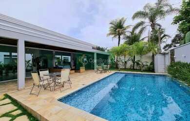 Imagem: A casa possui 5 Dormitórios, 5 Banheiros, 4 Vagas na garagem