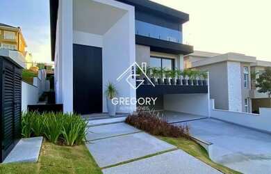 Imagem: A casa possui 4 Dormitórios, 5 Banheiros, 5 Vagas na garagem