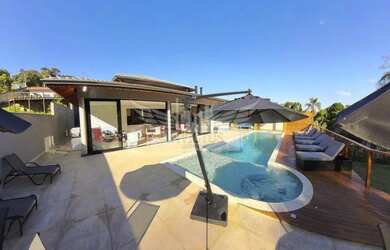 Imagem: A casa possui 5 Dormitórios, 5 Banheiros, 5 Vagas na garagem