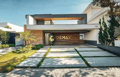 Imagem: A casa possui 4 Dormitórios, 5 Banheiros, 5 Vagas na garagem