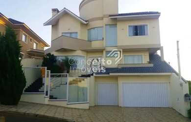 Imagem: A casa possui 3 Dormitórios, 4 Banheiros, 2 Vagas na garagem