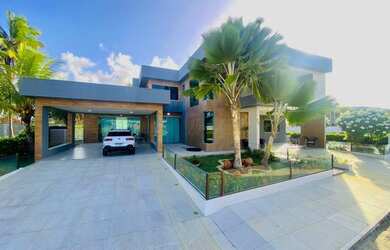 Imagem: A casa possui 5 Dormitórios, 5 Banheiros, 4 Vagas na garagem