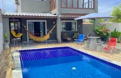 Imagem: A casa possui 5 Dormitórios, Acomodam 20 pessoas, 3 Vagas na