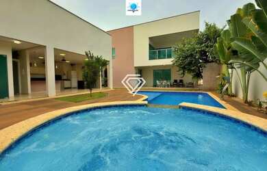 Imagem: A casa possui 4 Dormitórios, 4 Banheiros, 5 Vagas na garagem