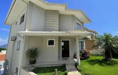 Imagem: A casa possui 3 Dormitórios, 4 Banheiros, 4 Vagas na garagem