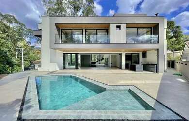 Imagem: A casa em condomínio possui 4 Dormitórios, 5 Banheiros, 5