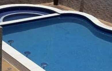 Imagem: A casa em condomínio possui 5 Dormitórios, 5 Banheiros, 2