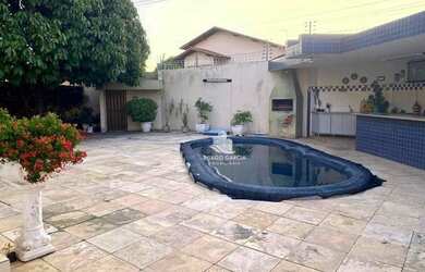 Imagem: A casa possui 4 Dormitórios, 5 Banheiros, 4 Vagas na garagem