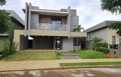 Imagem: A casa possui 4 Dormitórios, 5 Banheiros, 4 Vagas na garagem