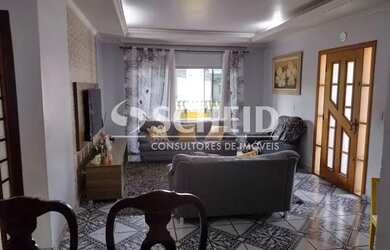 Imagem: A casa possui 3 Dormitórios, 5 Banheiros, 4 Vagas na garagem