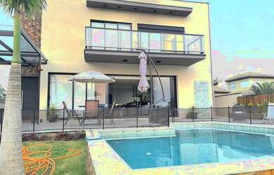 Imagem: A casa possui 5 Dormitórios, 5 Banheiros, 5 Vagas na garagem