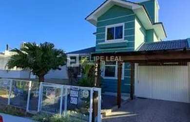 Imagem: A casa possui 3 Dormitórios, 3 Banheiros, 3 Vagas na garagem