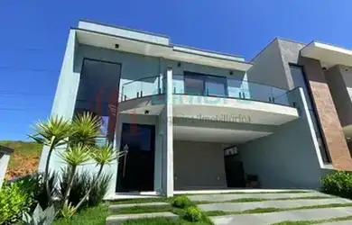 Imagem: A casa possui 3 Dormitórios, 5 Banheiros, 4 Vagas na garagem