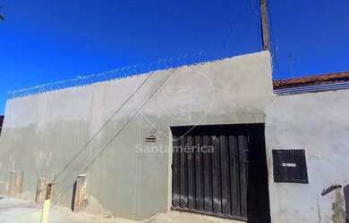 Imagem: A casa possui 3 Dormitórios, 1 Banheiro, 2 Vagas na garagem