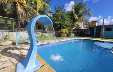 Imagem: A casa possui 4 Dormitórios, 4 Banheiros, 4 Vagas na garagem