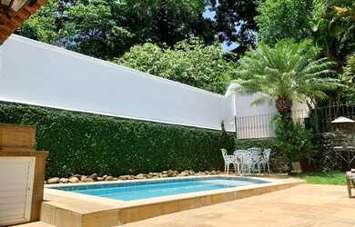 Imagem: A casa possui 3 Dormitórios, 4 Vagas na garagem e está localizado