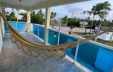 Imagem: A casa possui 5 Dormitórios, 5 Banheiros, 2 Vagas na garagem