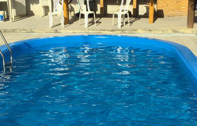 Imagem: A casa possui 4 Dormitórios e 4 Vagas na garagem e está localizado