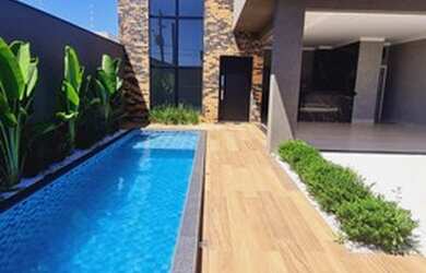 Imagem: A casa possui 3 Dormitórios, 4 Banheiros, 4 Vagas na garagem