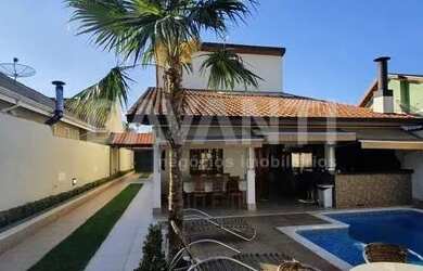 Imagem: A casa possui 3 Dormitórios, 4 Banheiros, 5 Vagas na garagem