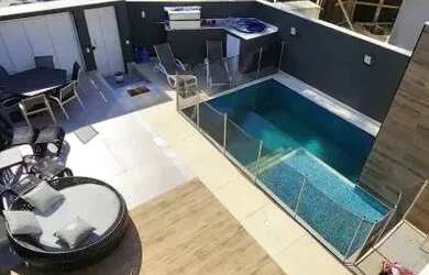 Imagem: A casa em condomínio possui 5 Dormitórios, 5 Banheiros, 2