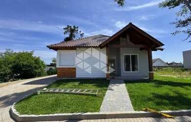 Imagem: A casa possui 3 Dormitórios, 3 Banheiros, 2 Vagas na garagem