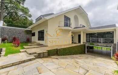 Imagem: A casa possui 4 Dormitórios, 5 Banheiros, 5 Vagas na garagem