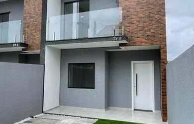 Imagem: A casa possui 3 Dormitórios, 2 Banheiros, 2 Vagas na garagem