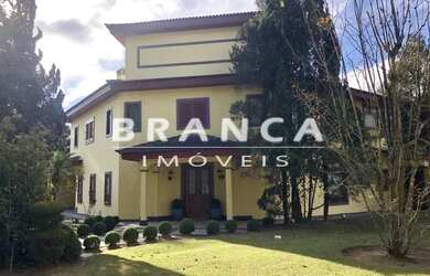 Imagem: A casa possui 4 Dormitórios, 5 Banheiros, 5 Vagas na garagem