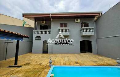 Imagem: A casa possui 4 Dormitórios, 4 Banheiros, 4 Vagas na garagem