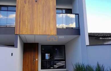 Imagem: A casa possui 3 Dormitórios, 3 Banheiros e 2 Vagas na garagem