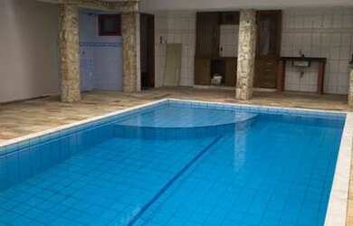 Imagem: A casa possui 4 Dormitórios, 5 Banheiros, 5 Vagas na garagem