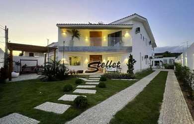 Imagem: A casa possui 5 Dormitórios, 5 Banheiros, 4 Vagas na garagem