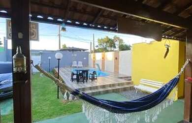 Imagem: A casa possui 3 Dormitórios, 2 Vagas na garagem e está localizado