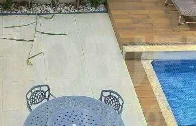 Imagem: A casa possui 4 Dormitórios, 5 Banheiros, 4 Vagas na garagem