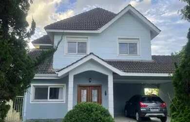 Imagem: A casa em condomínio possui 4 Dormitórios, 5 Banheiros, 4