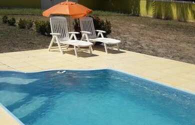 Imagem: A casa possui 2 Dormitórios, 3 Banheiros, 5 Vagas na garagem