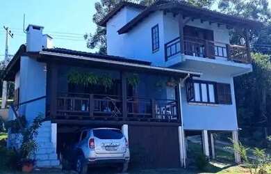 Imagem: A casa possui 3 Dormitórios, 3 Banheiros, 3 Vagas na garagem