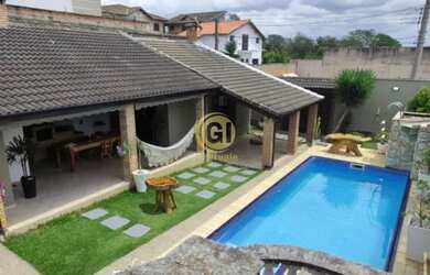 Imagem: A casa possui 3 Dormitórios, 3 Banheiros, 4 Vagas na garagem