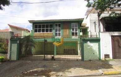 Imagem: A casa possui 3 Dormitórios, 2 Banheiros, 4 Vagas na garagem