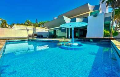 Imagem: A casa possui 4 Dormitórios, 5 Banheiros, 5 Vagas na garagem